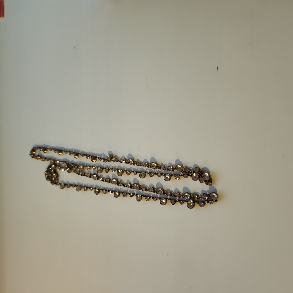 Costume necklace about 16 inches long if not double layered.